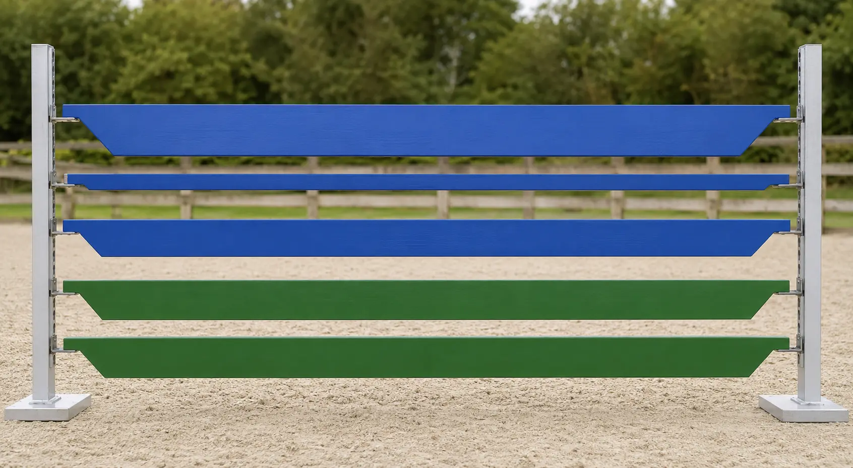 Standard colour ProHorse Plankers™ in blue and green mounted on aluminium uprights in a sand arena